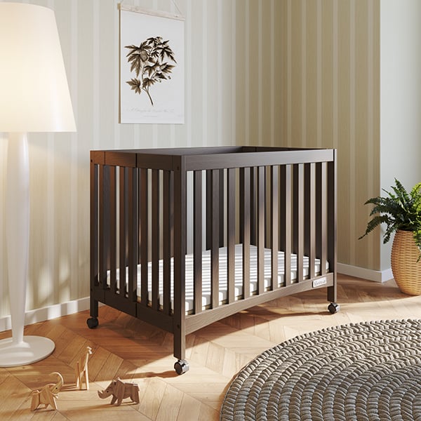 The London mini folding baby crib with Child Craft mattress